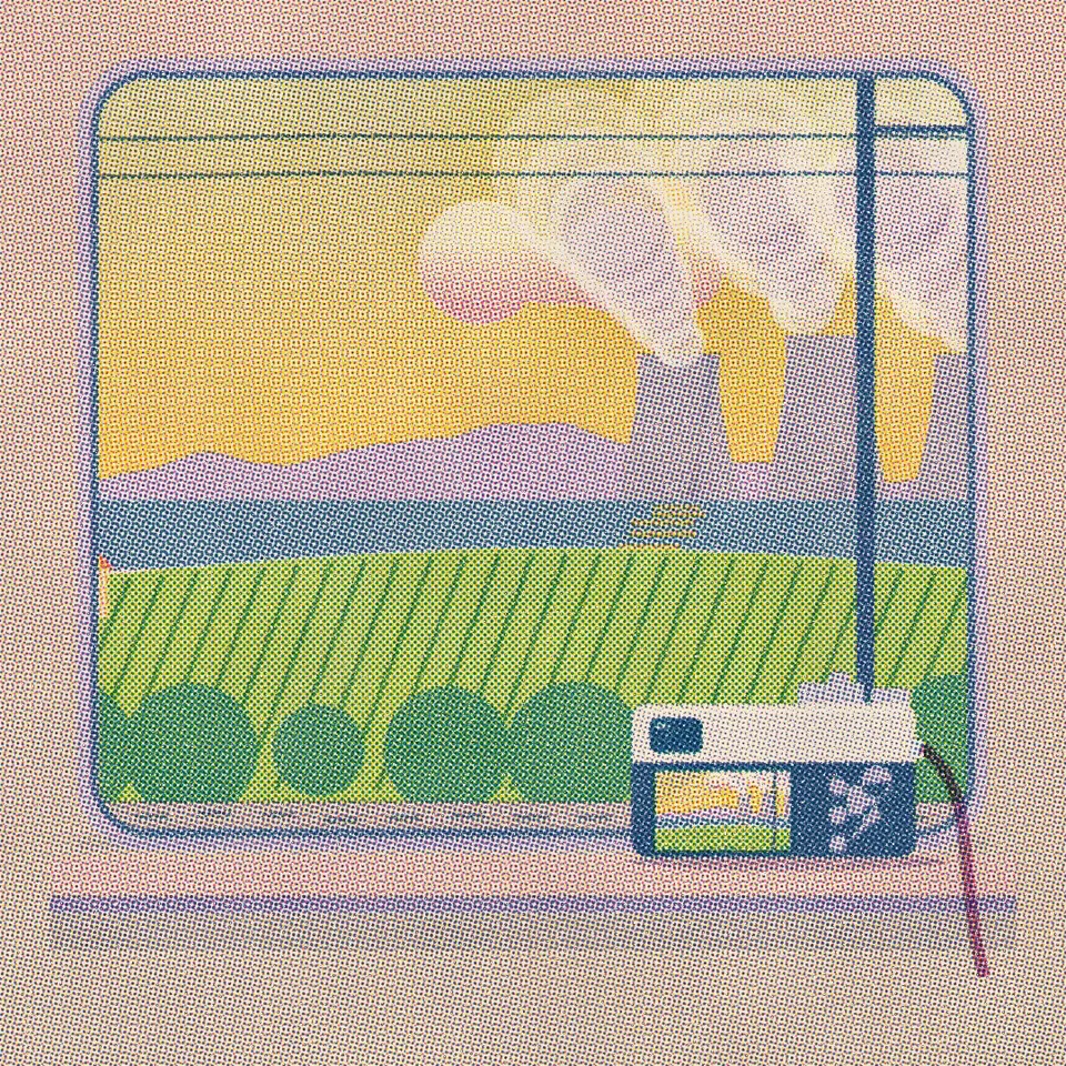 The Rhône valley: the river, a vineyard slope and nuclear cooling towers trailing steam